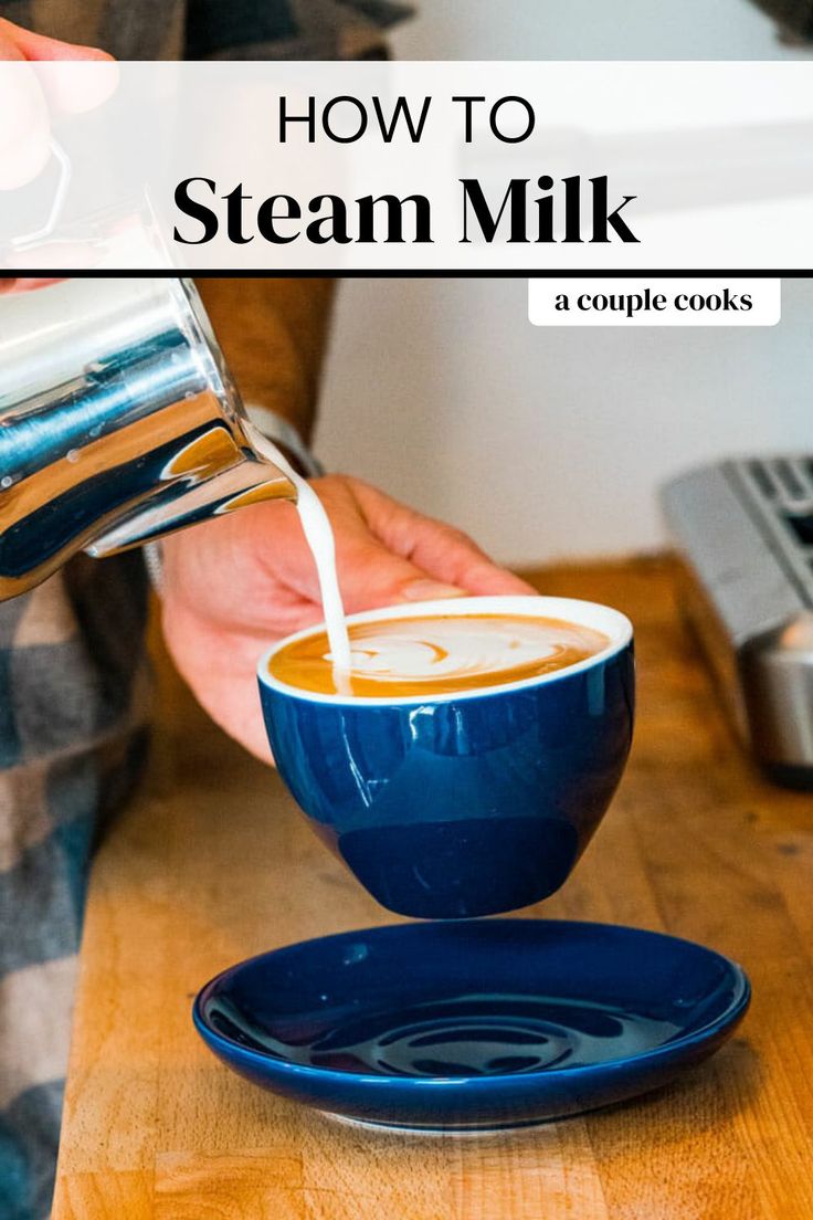 a person pouring milk into a blue bowl on top of a wooden table with the words how to steam milk