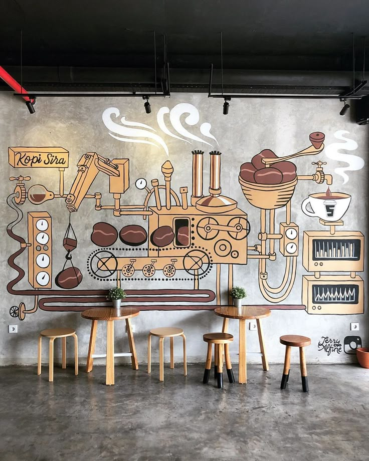 a mural on the wall of a coffee shop with wooden tables and stools in front of it