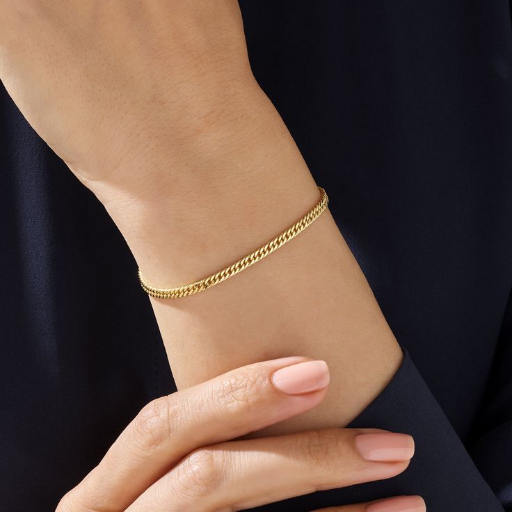 This delicate, handcrafted piece, designed for women, combines minimalist aesthetics with timeless charm. Crafted from real solid gold, it's a symbol of quality and durability. The Cuban links add a unique twist to the classic design, making it perfect for both day and night. Lightweight and flexible, it's ideal for layering with other Norm Jewels pieces.  Cherish not just a bracelet, but a handmade work of art with a story of quality craftsmanship and minimalist design. Bracelet Chain Details ❥ Gold KT: 14k Solid  Gold ❥ Chain Width: 2.90 mm ❥ Chain Thickness: 1.20 mm ❥ Gold Color Options: Yellow Gold, White Gold ❥ Ready to Ship in 4-7 Business Days MORE FROM US More Bracelets: https://etsy.me/3nc1GYi More about my shop: https://etsy.me/3mwMnsA ESSENTIAL INFORMATION 💎 BRENNMORE pieces ar Minimalist Adjustable Gold Bracelet With Delicate Chain, Classic Adjustable Bracelet With Delicate Chain, Minimalist Everyday Jewelry With Bracelet Strap, Everyday Minimalist Jewelry With Bracelet Strap, Delicate Bangle Bracelets For Everyday, Delicate Everyday Bangle Bracelets, Adjustable Tarnish Resistant Minimalist Chain Bracelet, Classic Hypoallergenic Chain Bangle Bracelet, Classic Hypoallergenic Bangle Chain Bracelet