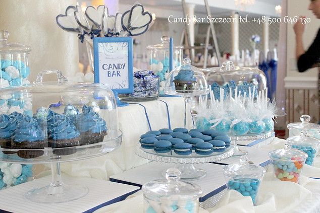 a table with blue and white desserts on it