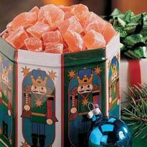 a box filled with candy sitting on top of a table next to other christmas decorations