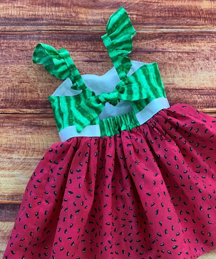 Your summer loving little girl will love her fun watermelon twirl dress!!  So perfect for a picnic, a garden party, a birthday gift or everyday fun with the perfect twirling factor! The bodice features a sweetheart neckline and is lined in a white cotton fabric.  The keyhole back ties with a knot with elastic at the back for a comfortable fit. The dress is easy care 100% cotton with the perfect twirling factor!  So much fun for play, parties and dress up occasions. There is an option available for flutter sleeves for a little dressier look. FINISHING:  All creations from Little Giggle Shop have been handmade in a smoke-free home with a Grandmother's Love. I take great pride in the quality of my designs.  The time is taken to professionally finish all edges which helps to prevent fraying in Watermelon Picnic, One In A Melon Birthday, Party Dress Summer, Watermelon Dress, Dress Garden, Grandmothers Love, Summer Loving, Picnic Dress, Garden Party Dress