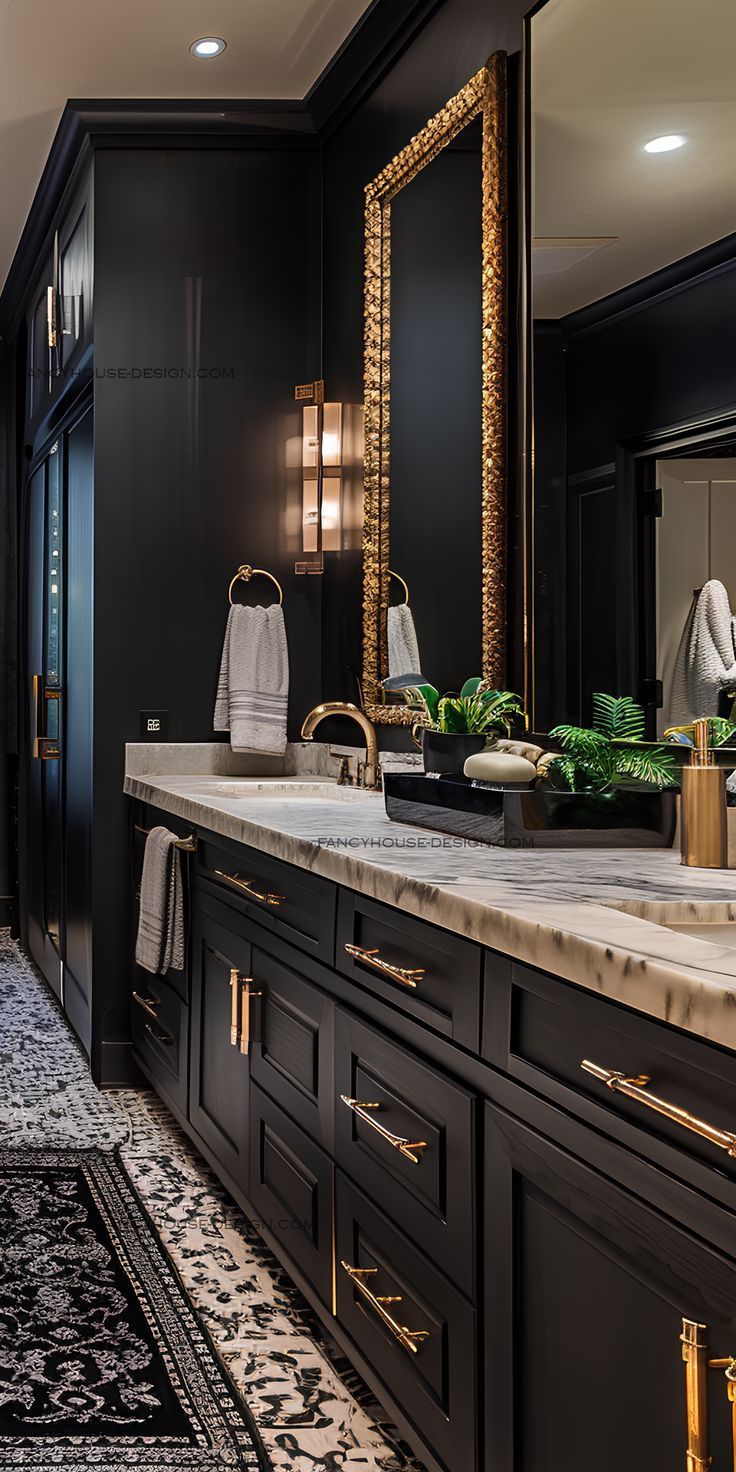 a bathroom with black cabinets and gold accents