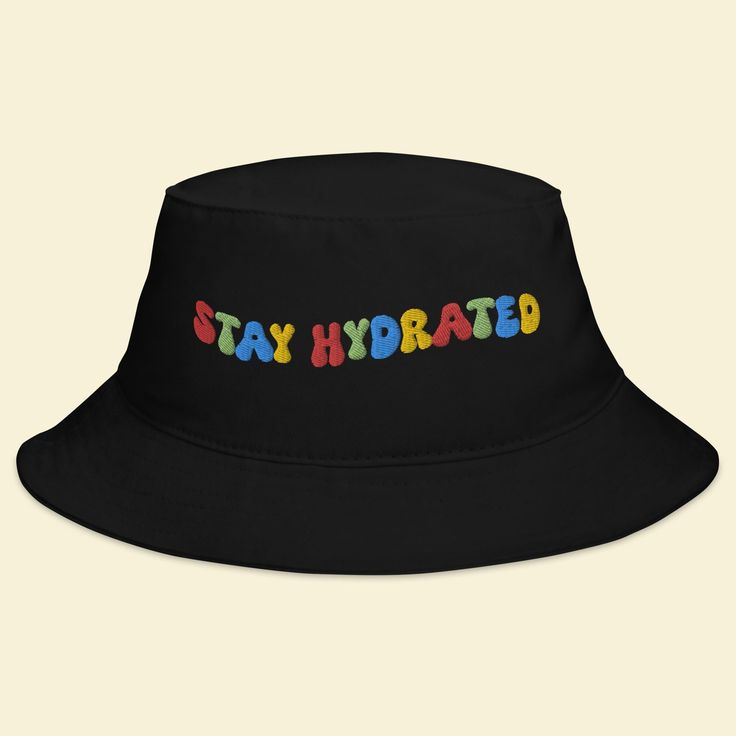 a black bucket hat with the words stay hydrated in multicolored letters on it