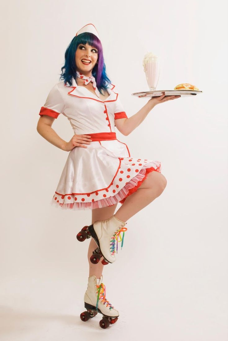 a woman dressed as a waitress holding a plate