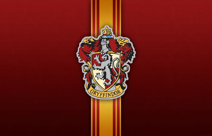 a red and yellow striped wallpaper with the hogwart crest on it's side