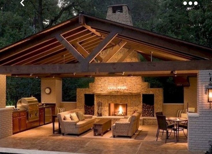 an outdoor living area is lit up at night