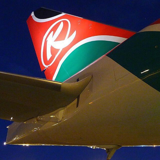 the tail end of an airplane that is red, green and white with a klm logo on it