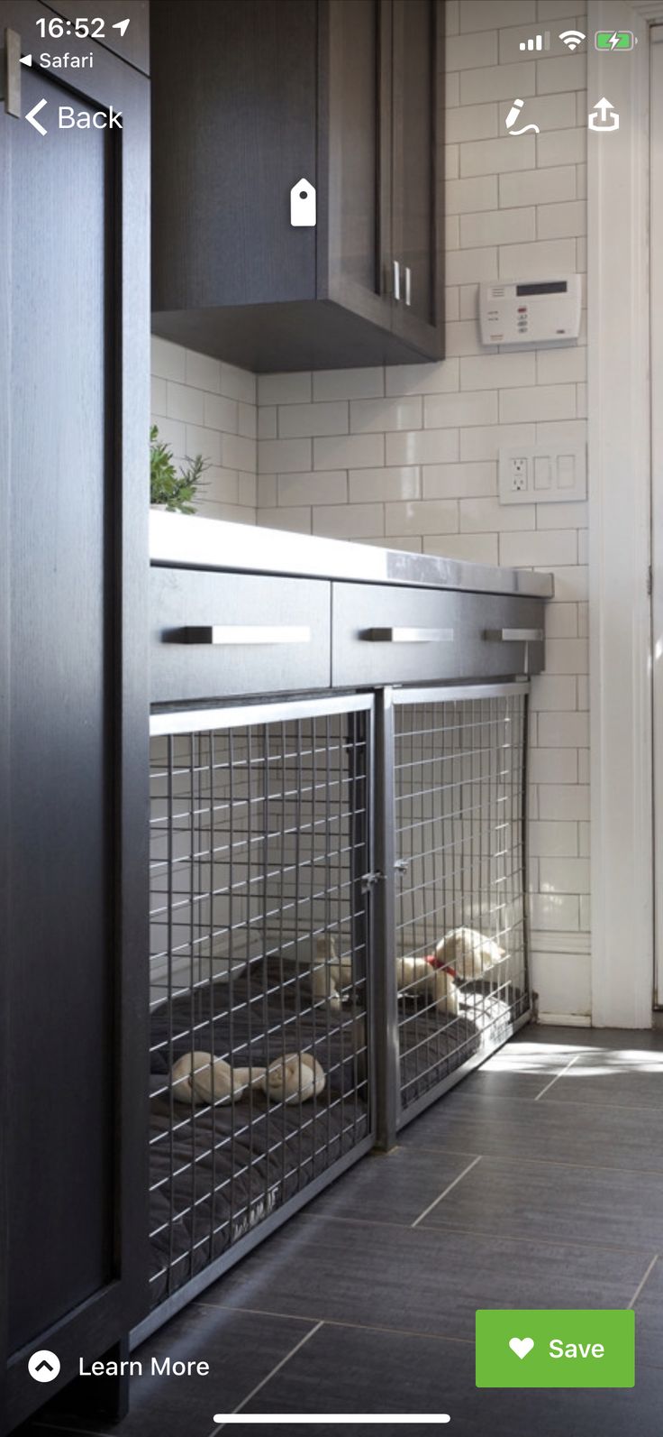 a dog kennel in the middle of a kitchen