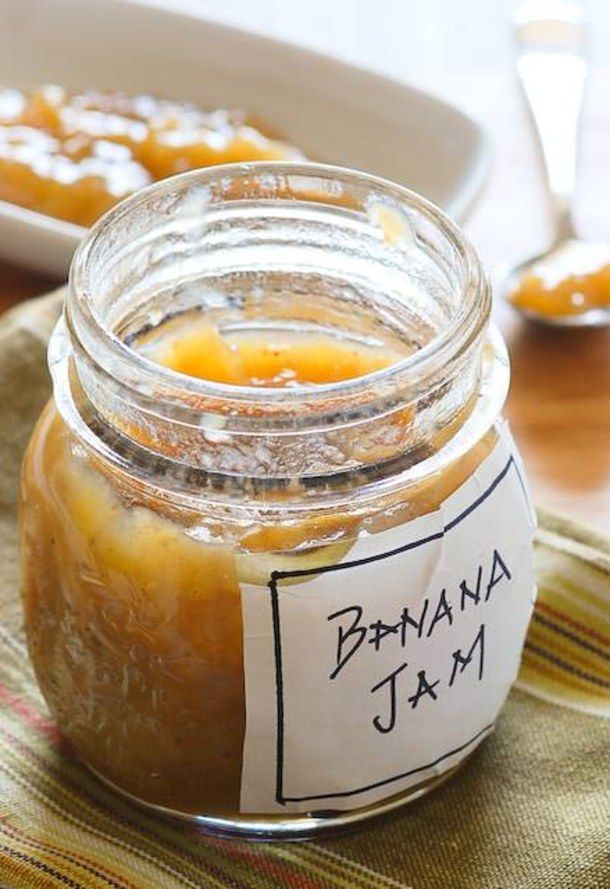 a jar filled with jam sitting on top of a table