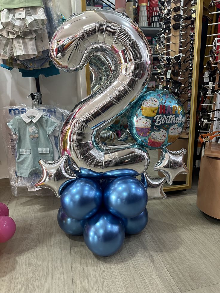 some balloons are stacked on top of each other in the shape of numbers 2 and 3