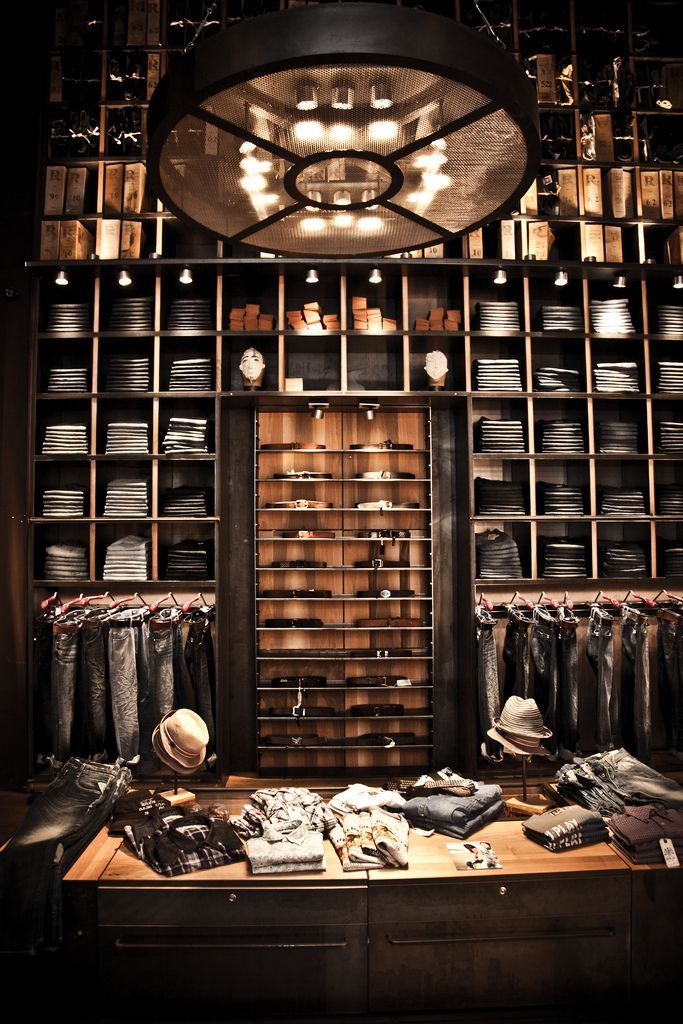 the inside of a clothing store with lots of items