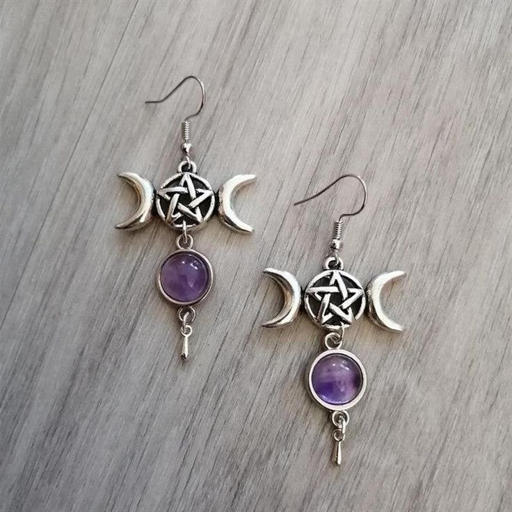 Invoke the power of the divine feminine with these beautiful triple moon earrings! Featuring pentagrams and amethyst crystals, they offer powerful spiritual protection against unwanted energies. Material: Metal; Amethyst crystal Earring Type: Ear hooks Earring Size: 6.2cm long (2.4 inches) Recommended Occasions & Uses: Wiccan protection amulet, witchy jewelry, pagan fashion, Wiccan gift. Package Contents: 1x pair of earrings Wicca Pentagram, Spiritual Elevation, Wiccan Earrings, Crescent Moon Jewelry, Wiccan Jewelry, Gothic Earrings, Witch Magic, Witch Jewelry, Pagan Jewelry