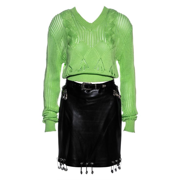 ▪ Gianni Versace runway ensemble ▪ Black leather pencil skirt ▪ Neon green knitted v-neck sweater ▪ Orange mesh cycling shorts with lace trim ▪ Large silver Medusa safety pin adornments ▪ IT 42 - FR 38 - UK 10 - US 6 ▪ Spring-Summer 1994 Safety Pin Skirt, Gianni Versace 90s, Shorts With Lace Trim, Skirt And Sweater, Beige Pencil Skirt, Suits Outfits, Black Leather Pencil Skirt, Versace Runway, Shorts With Lace