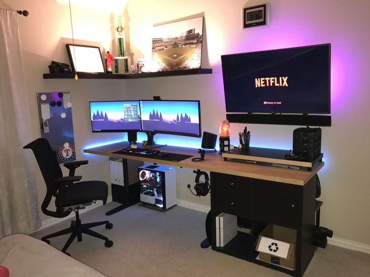 a computer desk with two monitors on it