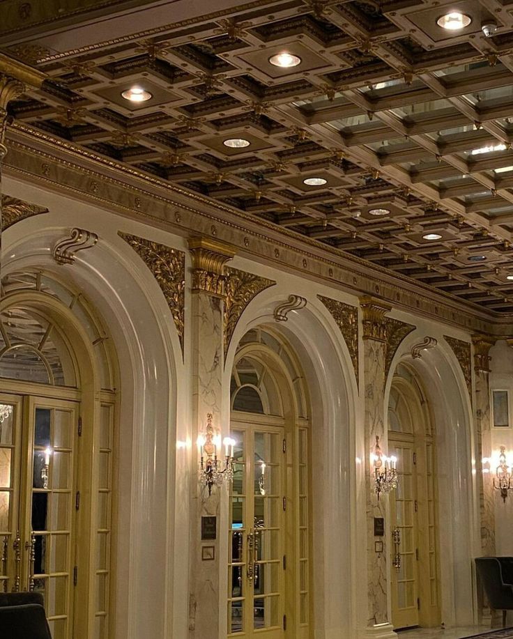 an ornately decorated lobby with chandeliers and marble floors