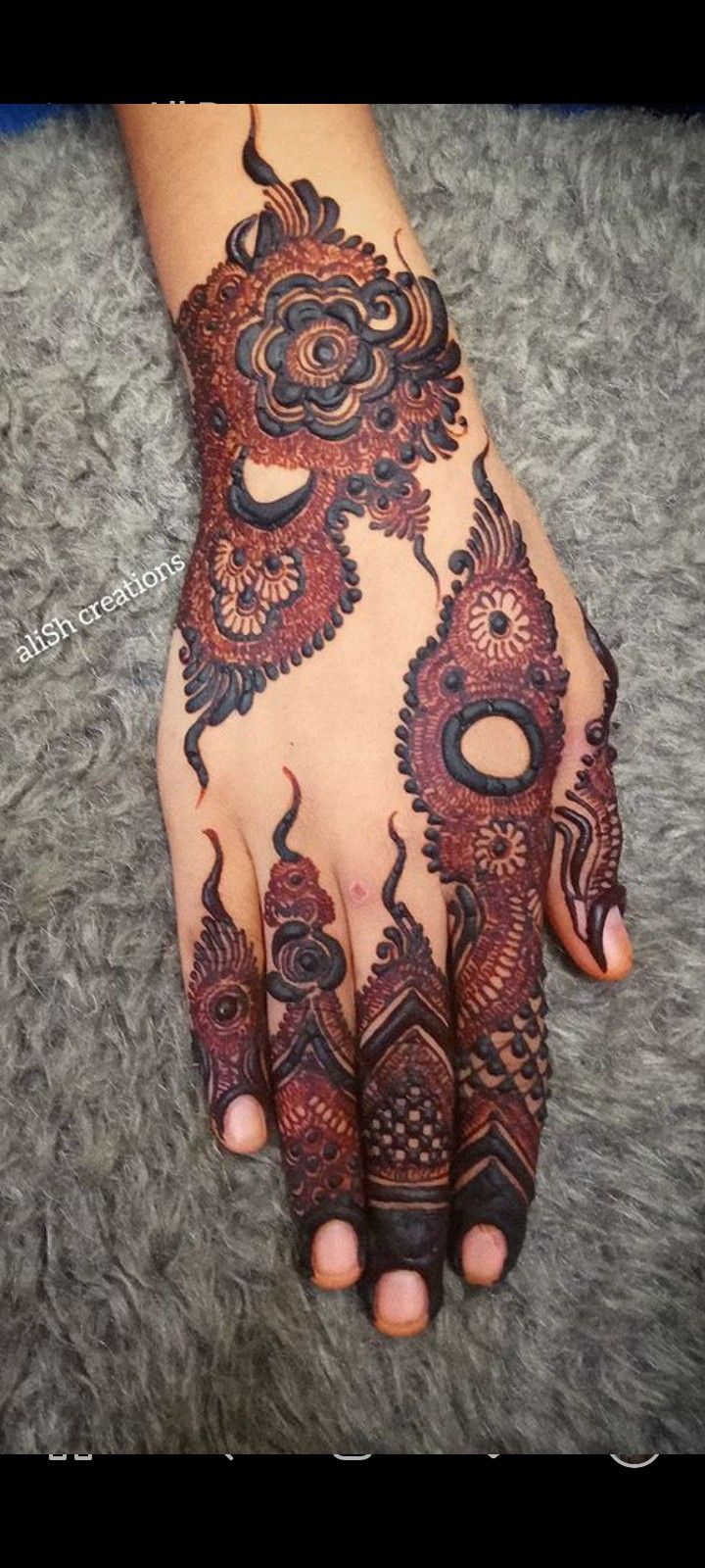 the hand is decorated with intricate designs