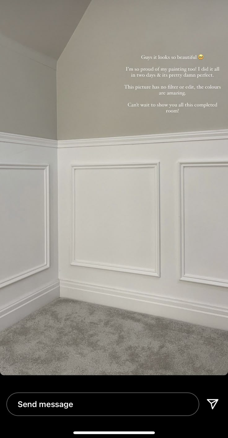 an empty room with white paneling on the walls and carpeted floor, is shown