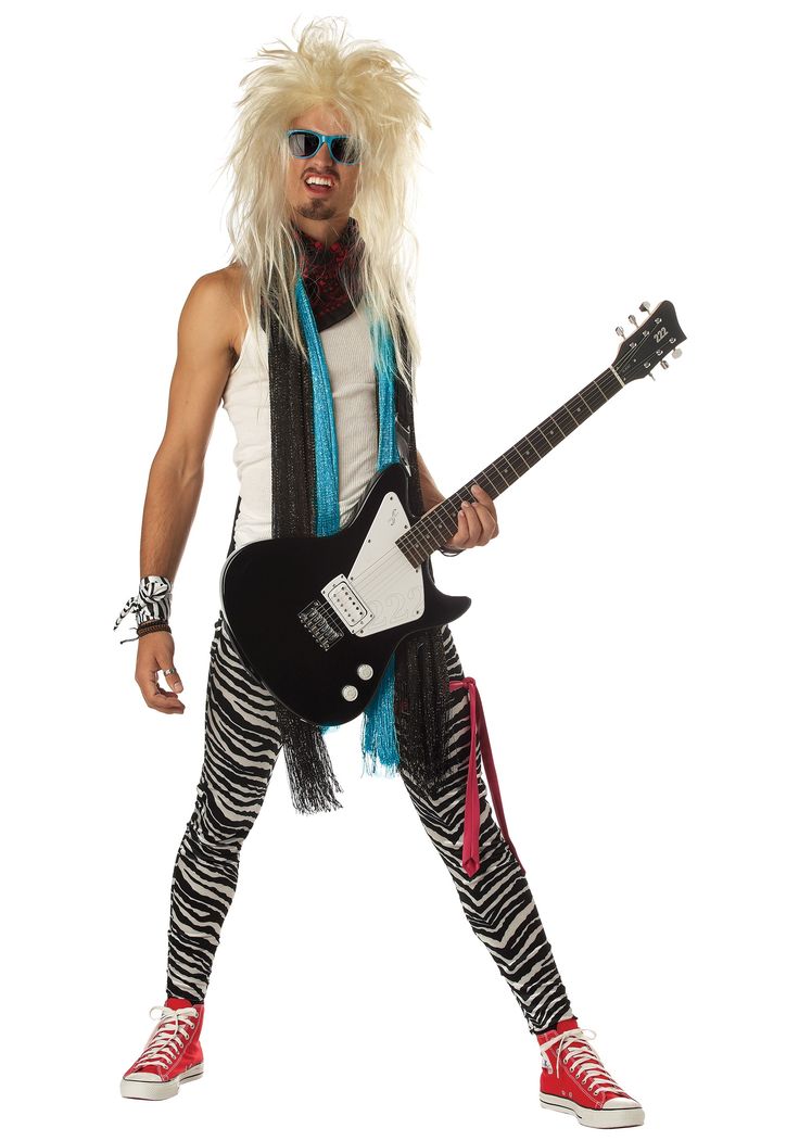 a man with long hair and glasses holding a guitar in his right hand while wearing zebra print leggings