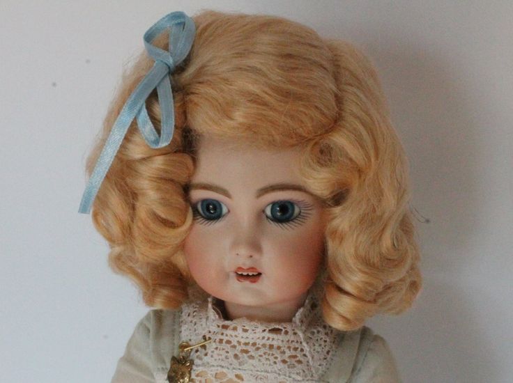 The Daisy style wig is the classic German wig found on the popular Kestner 171 Daisy doll and many other German dolls. This wig has a side part with bangs pulled back in a bow with two staggered rows of soft ringlet curls surrounding the head. Made of the finest quality mohair. The colors resemble those of the original antique dolls. This wig is sure to enhance the beauty of your antique doll when only the best will do Bangs Pulled Back, Side Part With Bangs, Pull Back Bangs, Ringlet Curls, Style Wig, Doll Wig, German Dolls, Doll Wigs, Creepy Dolls