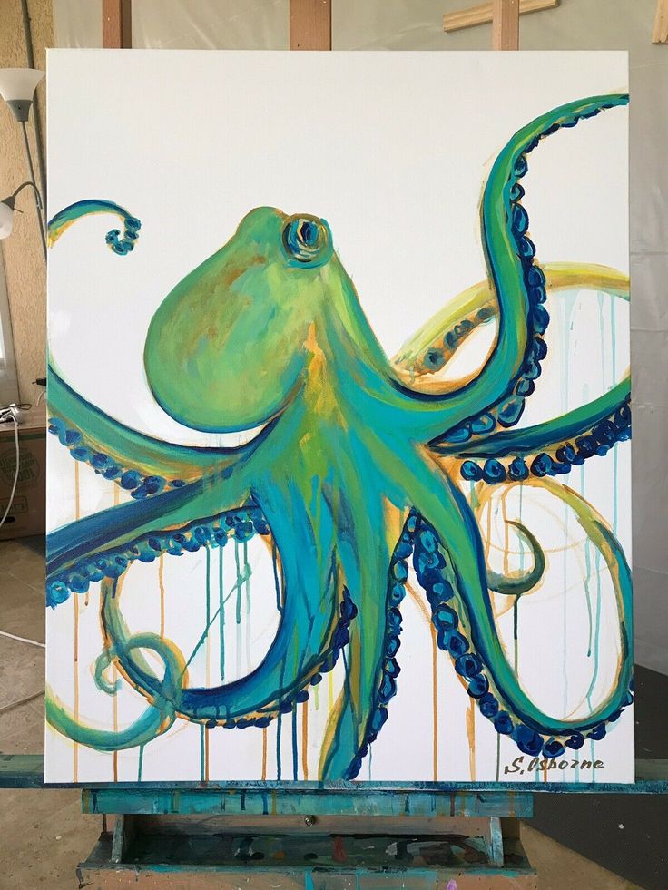 an octopus painting is being displayed on a easel