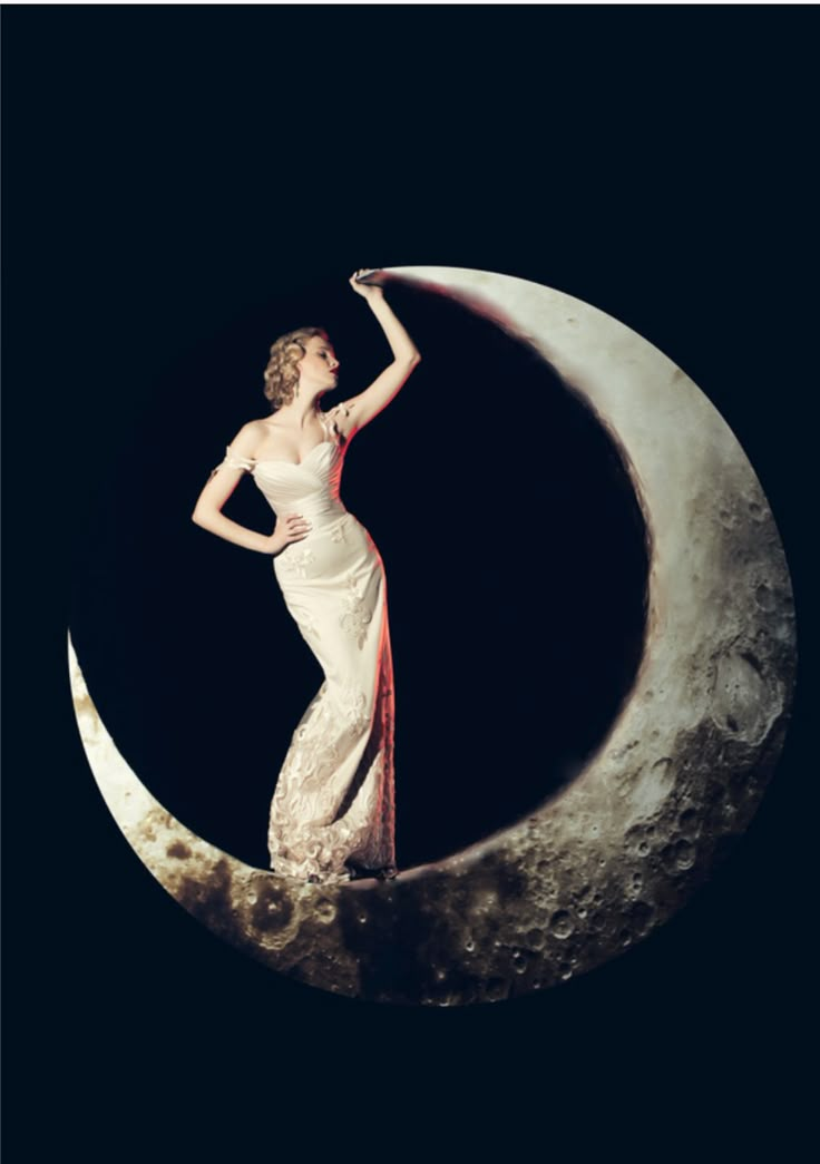 a woman in white dress standing on the moon