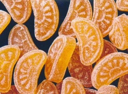 an image of orange slices on black background