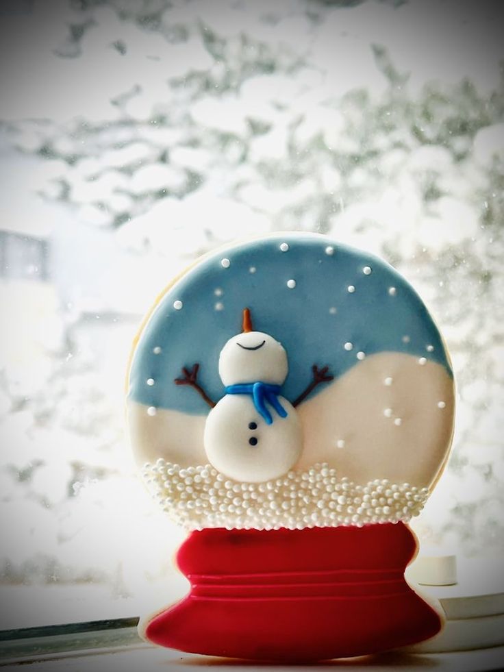 a snow globe sitting on top of a window sill