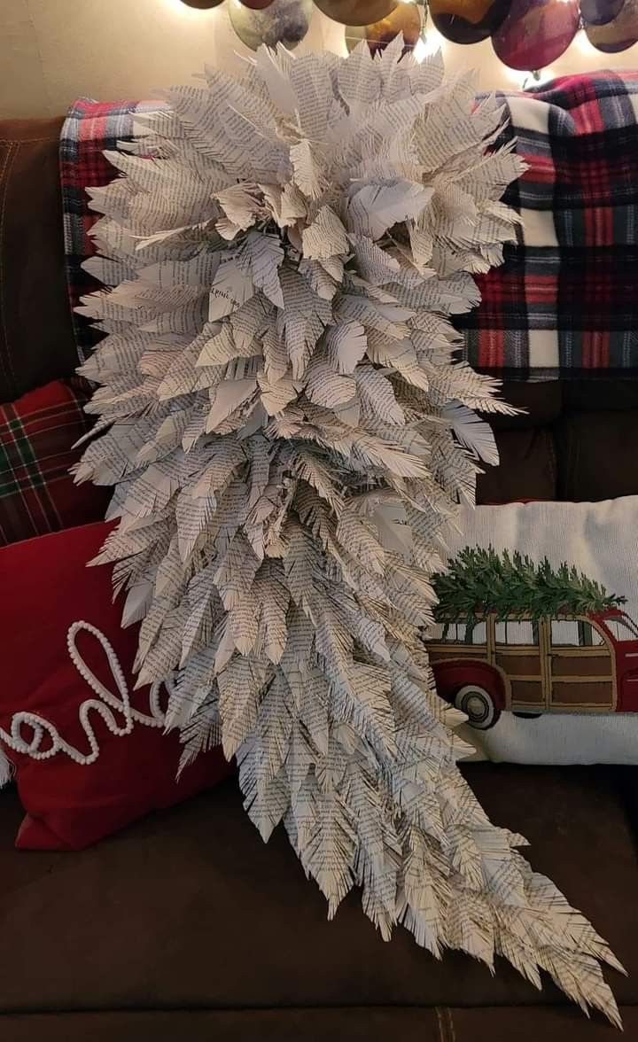 a white christmas tree sitting on top of a couch