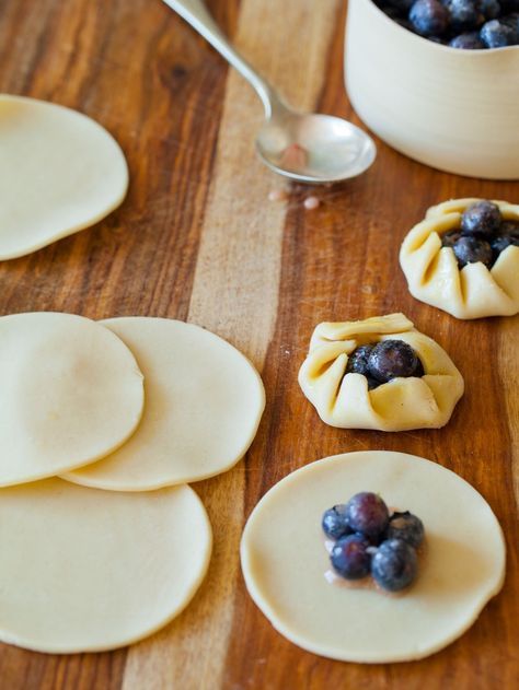 some blueberries and other food items on a wooden table