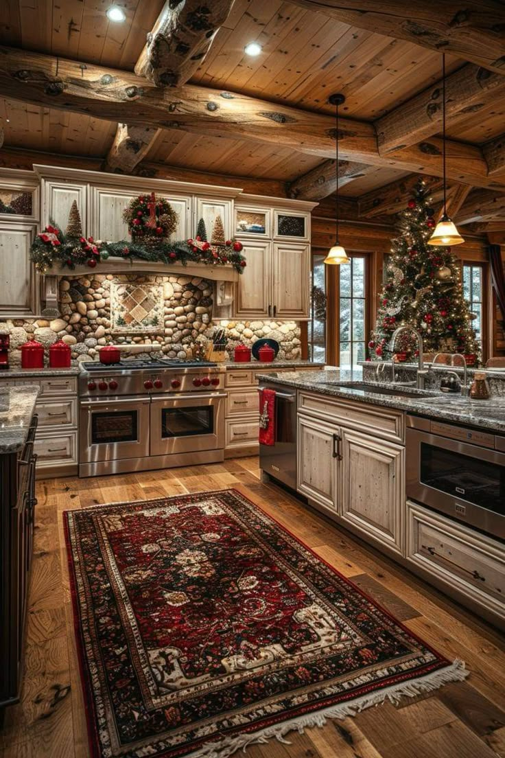 a kitchen decorated for christmas with white cabinets and wood floors, an area rug on the floor