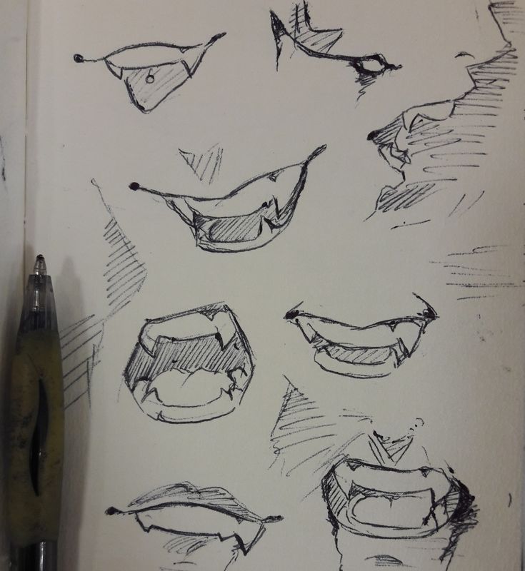 several different types of mouths drawn on paper with a pen in front of the drawing