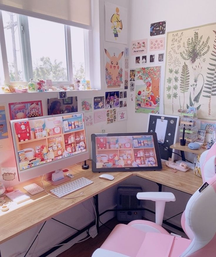 a desk with two computer monitors on top of it and a pink chair next to it