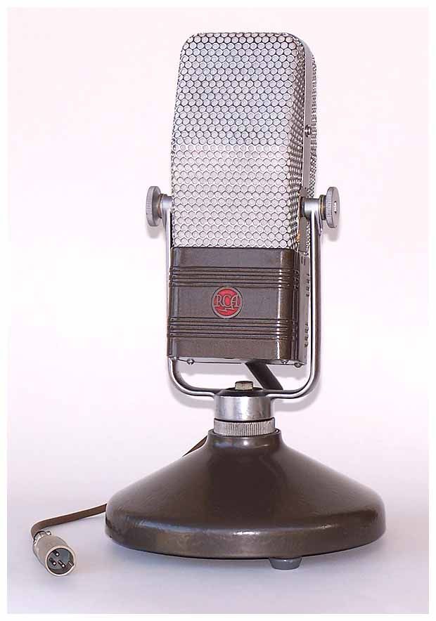 an old fashioned microphone sitting on top of a table