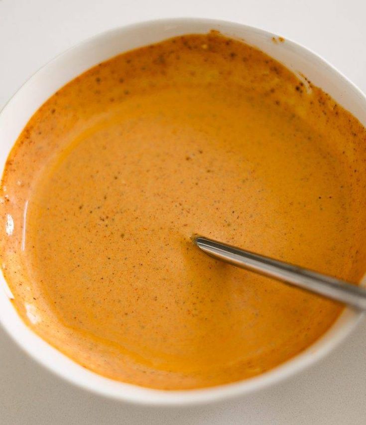 a bowl of soup with a spoon in it