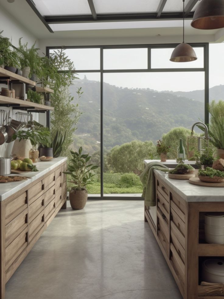 a kitchen filled with lots of counter top space next to a tall glass wall covered in greenery