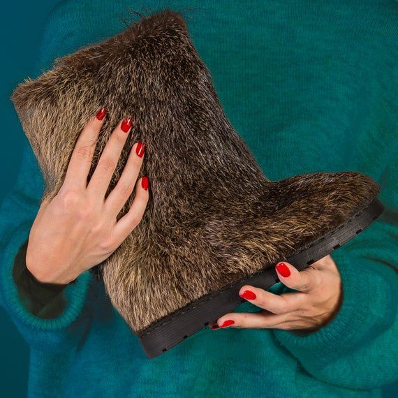 These brown color winter fur boots from natural fur of a nutria  are invaluable boots for cold winter weather.They are designed for women who love the uniqueness and warmth, as withstand up to 50 degrees Celsius below zero.Lined by warm, cozy genuine sheepskin. Only high quality materials are used, so this amazing boots will last you a long time!WATERPROOF!Through the use of waterfowl animal fur can be used in the slush and mud! they don't get wet! easily cleaned of dirt.COLORS:These beautiful b Yeti Boots, Winter Fur Boots, Mukluk Boots, Fox Fur Boots, Boots Long, Below Zero, Animal Fur, Beautiful Boots, Fur Boots