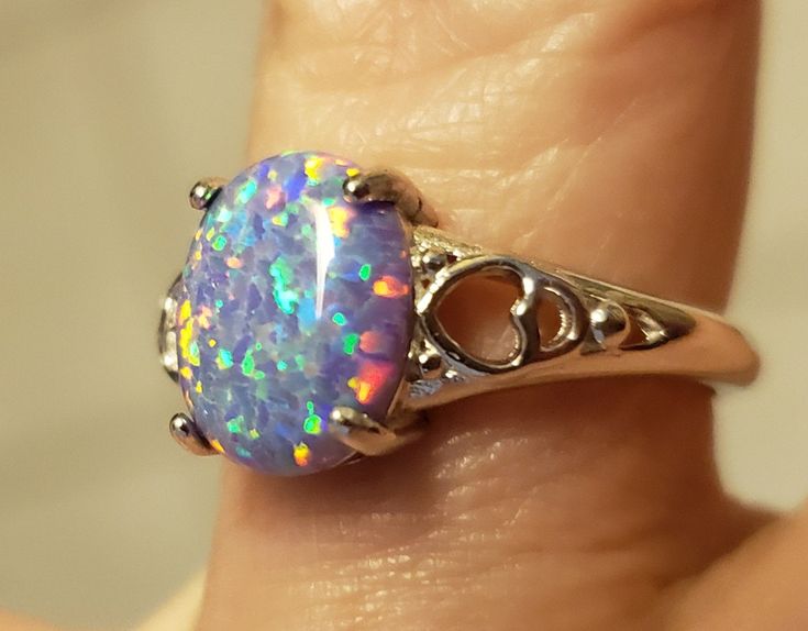 Sweetheart Lavender Purple Lab Created Opal Ring. Multicolored Fire In This 8x10mm Opal, Set In 925 Sterling Silver Heart Design Ring, Adjustable Size From 5-9.5 Comfortably. Great Gift! Gift Box Included. Metal Jewelry Handmade, Fire Opal Engagement Ring, Fire Opal Necklace, Fire Opal Ring, Sterling Silver Jewelry Handmade, Engagement Rings Opal, Couple Jewelry, Pretty Rings, Fantasy Jewelry