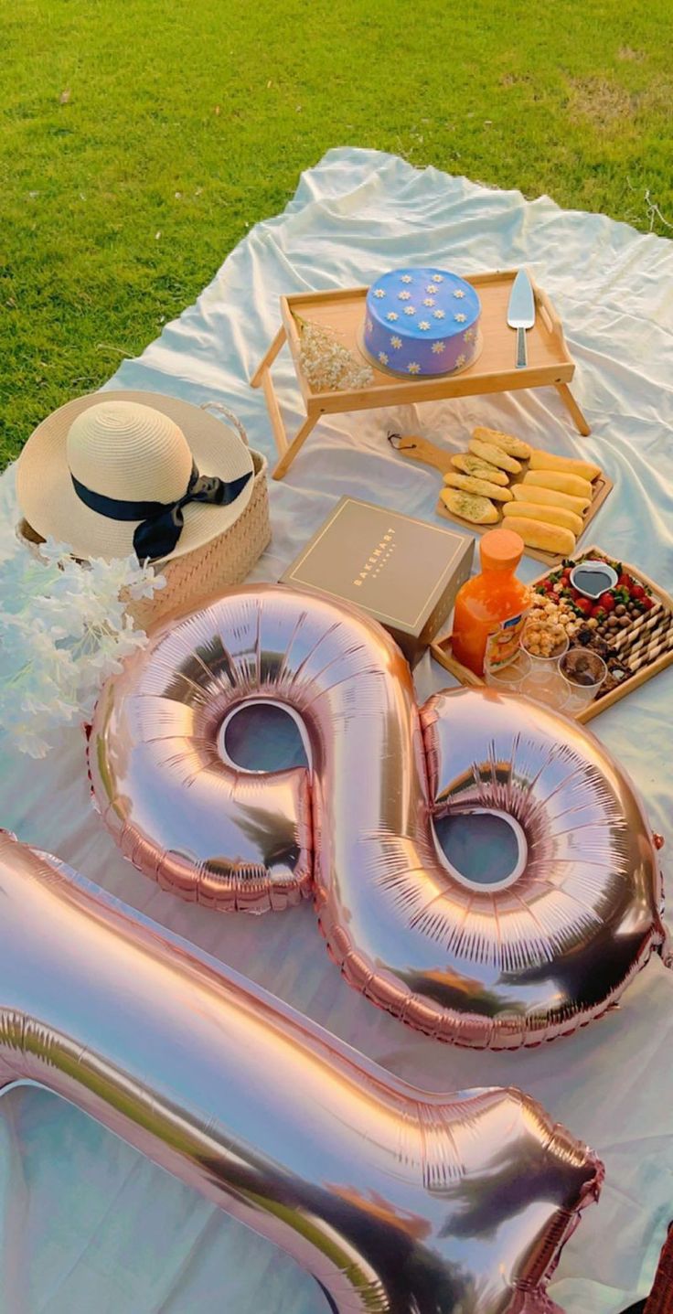 a large balloon shaped like the number twenty sits on top of a table with other items