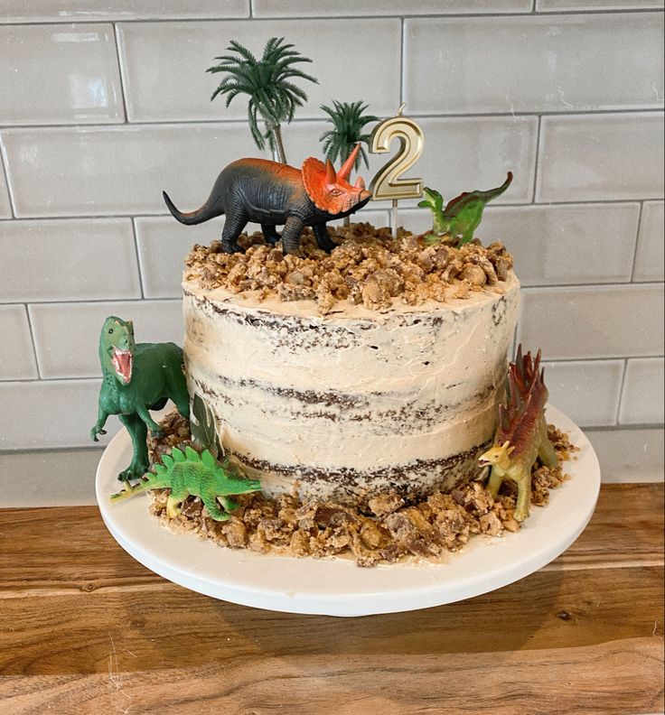 Dinosaur cake perfect for kids birthday Dinosaur Three Rex Cake, Dinosaur Birthday Cake 3 Year, 3 Rex Dinosaur Cake, Dinofour Birthday Cake, Threerex Birthday Cake, Homemade Dino Cake, Easy Dinosaur Birthday Cake, Roar Im 4 Birthday Cake, Dinosaur Cake For 2nd Birthday