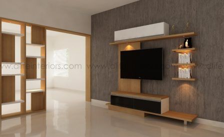 a living room with a tv and shelving unit in the middle of the room