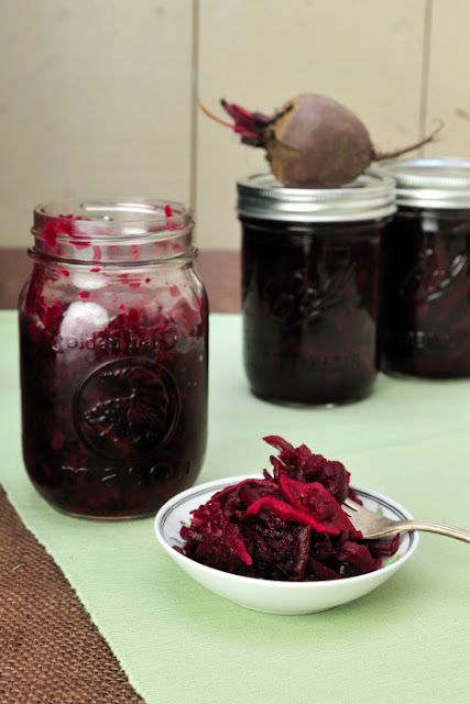 beets in jars with spoons on table