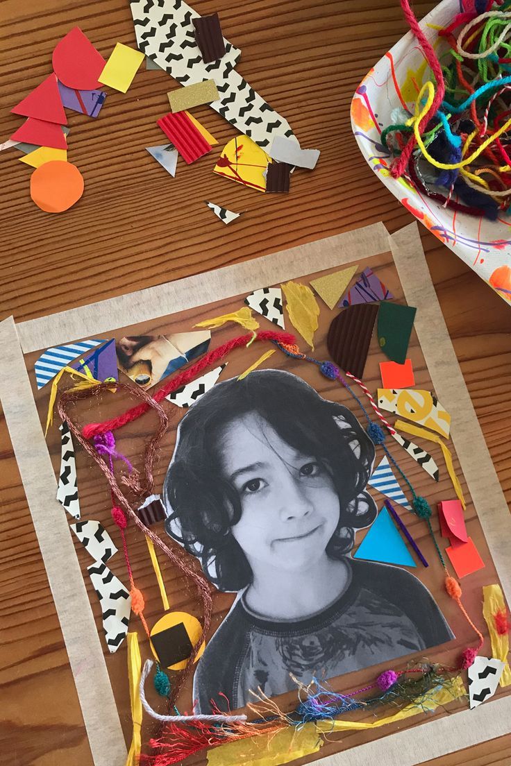 a table topped with lots of colorful paper and crafting supplies on top of it