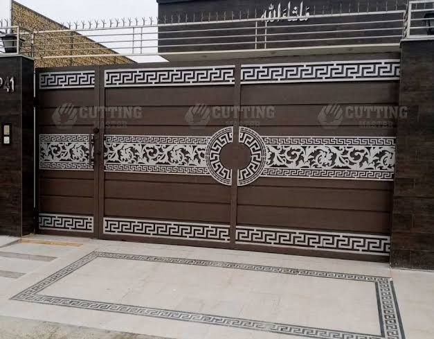 a brown garage door with an intricate design on the front and side panels, along with a white border around it