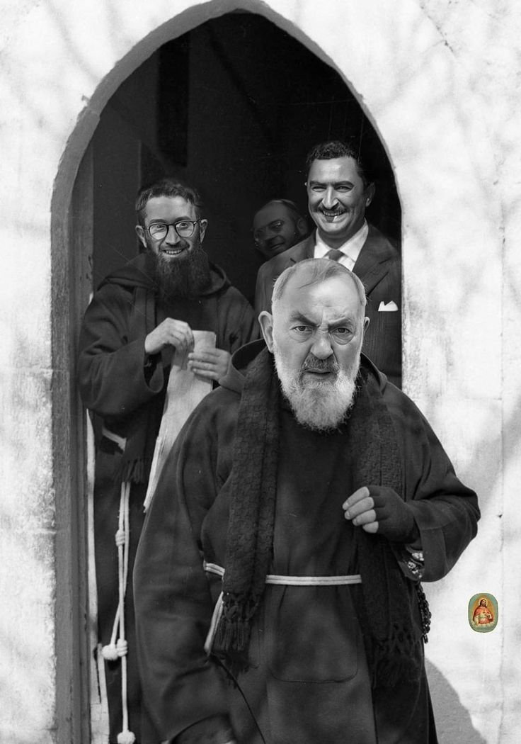 black and white photograph of two men with beards standing in front of a doorway