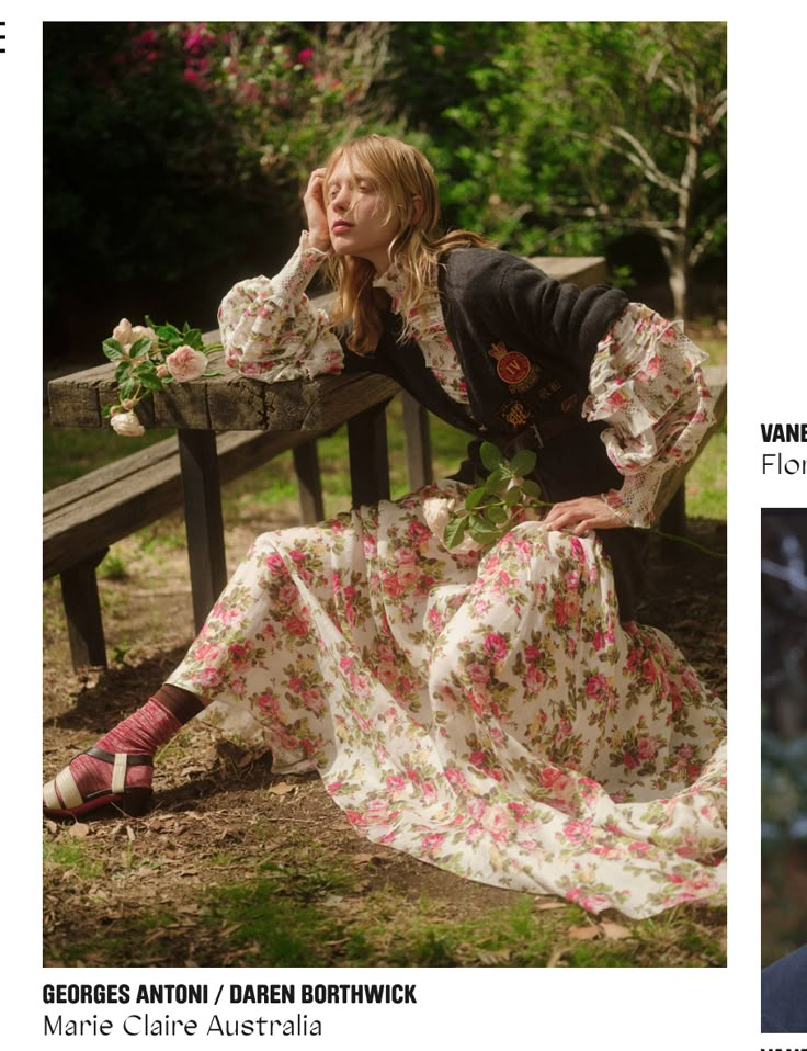 a woman is sitting on a bench with flowers