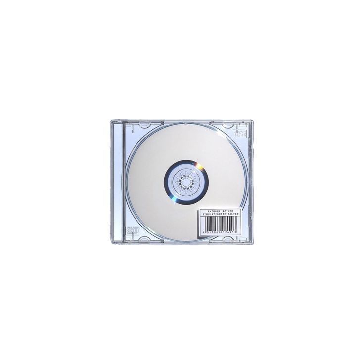 an image of a cd that is on the white surface and has a small disc in it