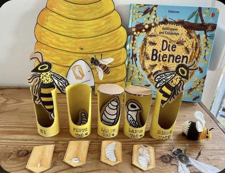 bees and honeybees are on display in front of a beehive book