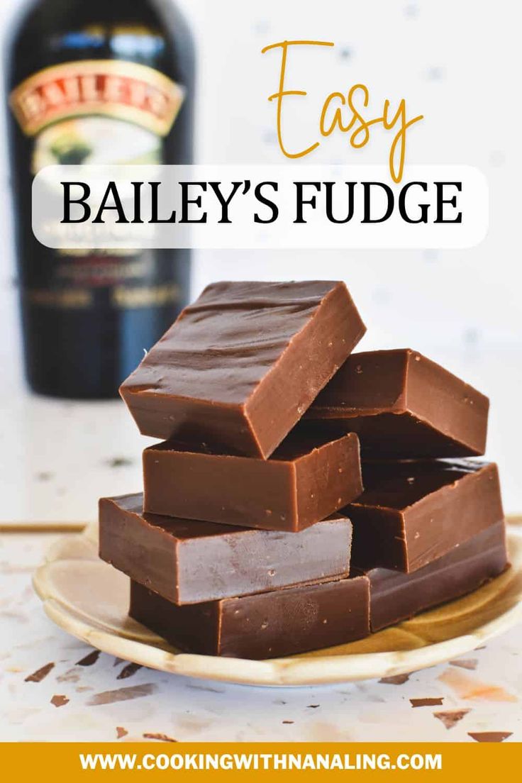 chocolate fudge on a plate next to a bottle of bailey's irish whiskey