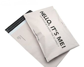 two envelopes sitting next to each other on top of one another with the word hello it's never printed on them